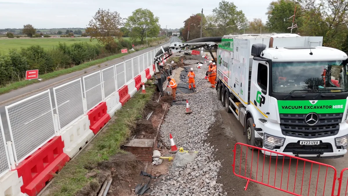 A Green Power vacuum excavation lorry at work beside a road at Hathern