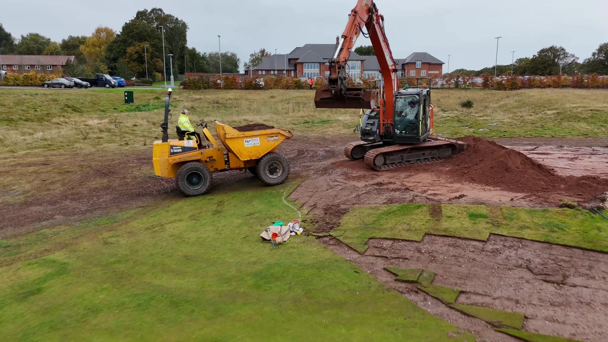 An excavator and a dumper reshaping a bunker at Whittington Golf Course